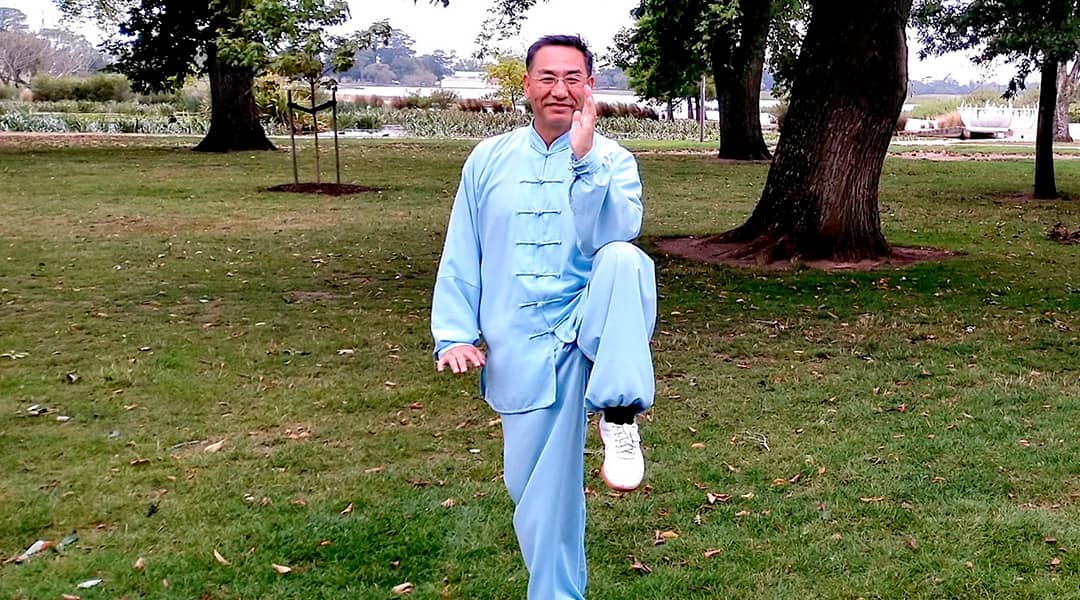 Photo of Jack Yang wearing light blue tradition Chinese outfit